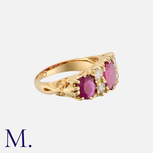 84 - A Vintage Ruby And Diamond Ring in 18k yellow gold, set with three oval cut rubies totalling approxi... 