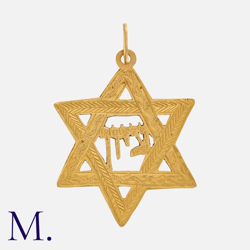 85 - A Star Of David Pendant in yellow gold, the ornate engraved star depicting the word 'Zion' in Hebrew... 