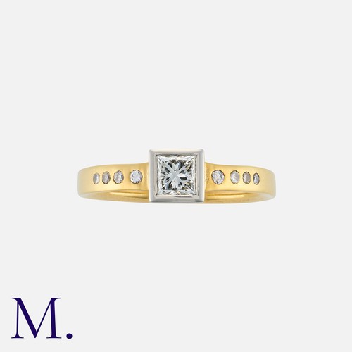 87 - A Diamond Solitaire Ring in 18K yellow and white gold, set with a princess cut diamond weighing 0.41... 