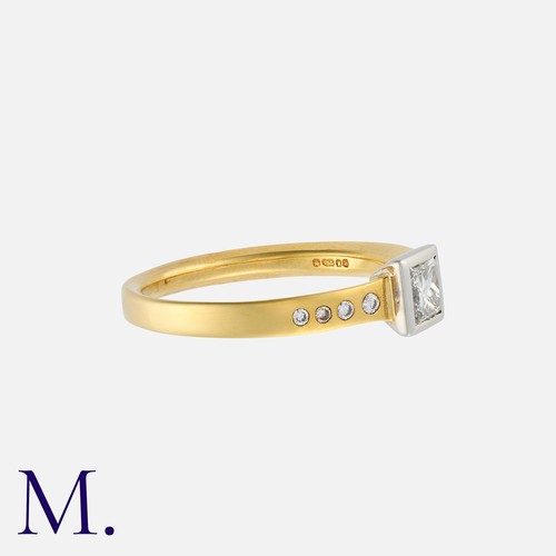 87 - A Diamond Solitaire Ring in 18K yellow and white gold, set with a princess cut diamond weighing 0.41... 