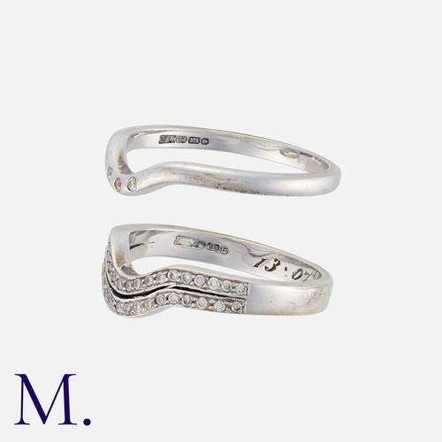 256 - A Pair of Diamond 'Enhancer' Rings in 9K white gold.  Ring one set with two rows of round cut diamon... 