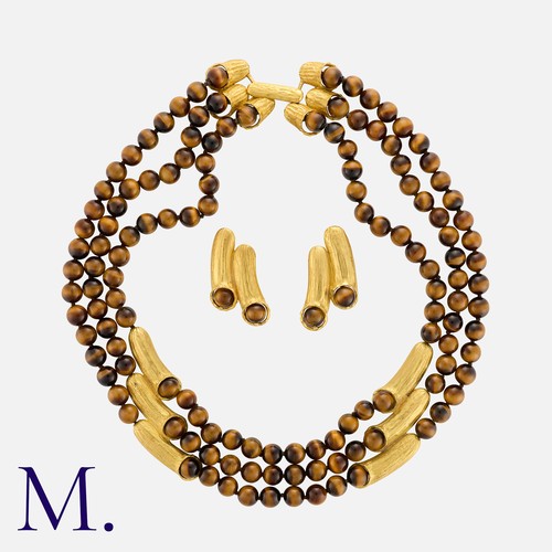 109 - A Tiger's Eye Necklace And Earring Suite in yellow gold, comprising three rows of polished tigers ey... 