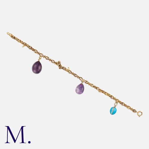 142 - An Egg Charm Bracelet in yellow gold, comprising a series of interlocking fancy links, suspending tw... 