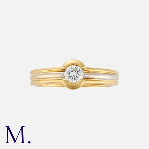 157 - A Diamond Ring in 18K yellow and white gold, set with a single round brilliant cut diamond, weighing... 