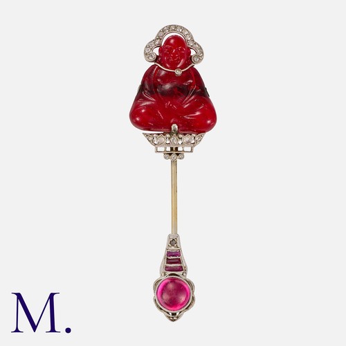 140 - GHISO,  An Art Deco Buddha Sûreté Pin, in 18 carat gold, comprising a red pâte de verre buddha, acce... 