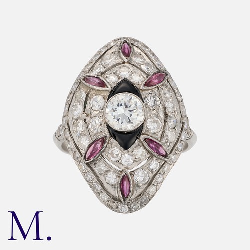 177 - An Art Deco Ruby, Onyx and Diamond Ring in platinum, set with a round cut diamond to the centre weig... 