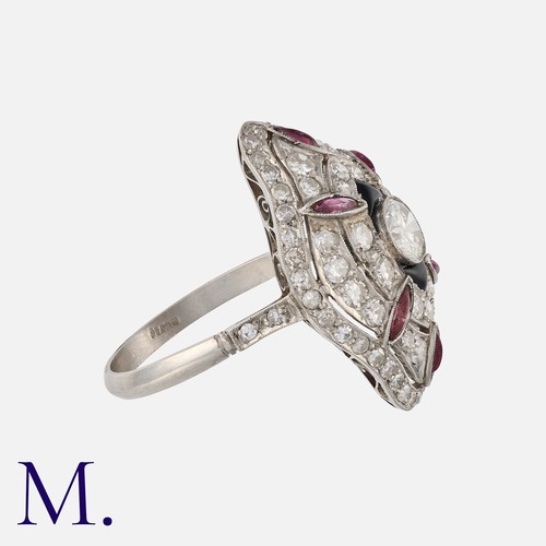 177 - An Art Deco Ruby, Onyx and Diamond Ring in platinum, set with a round cut diamond to the centre weig... 