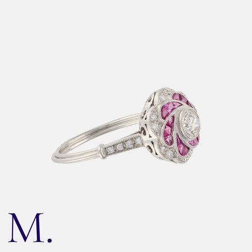 176 - An Art Deco Style Ruby and Diamond Ring in platinum, set with an old cut diamond to the centre weigh... 