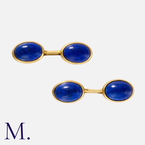 175 - SHREVE & CO, A Pair of Lapis Lazuli Cufflinks in 14 carat yellow gold, each comprising two collet-se... 