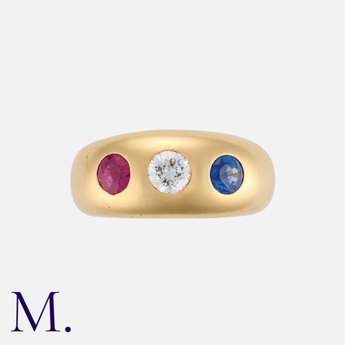 136 - A Vintage Ruby, Sapphire and Diamond Three Stone Gypsy Ring in 18 carat gold, set with a round cut d... 