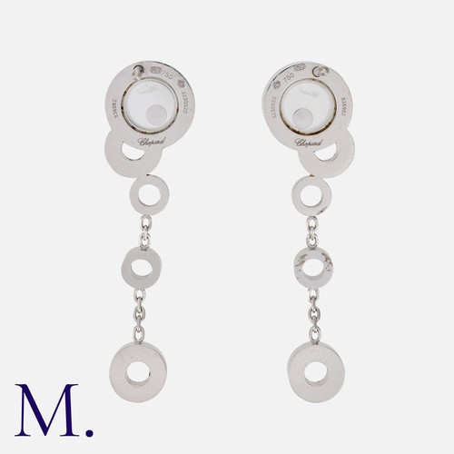163 - CHOPARD. A Pair of Happy Diamond Drop Earrings in 18K white gold, with glazed circular design with f... 