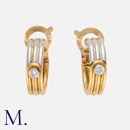 150 - VAN CLEEF & ARPELS. A Pair of Diamond Hoop Earrings in 18K yellow and white gold, with ribbed white ... 