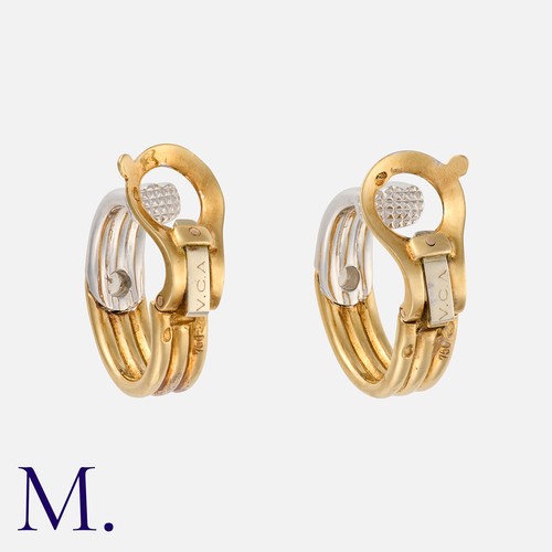 150 - VAN CLEEF & ARPELS. A Pair of Diamond Hoop Earrings in 18K yellow and white gold, with ribbed white ... 