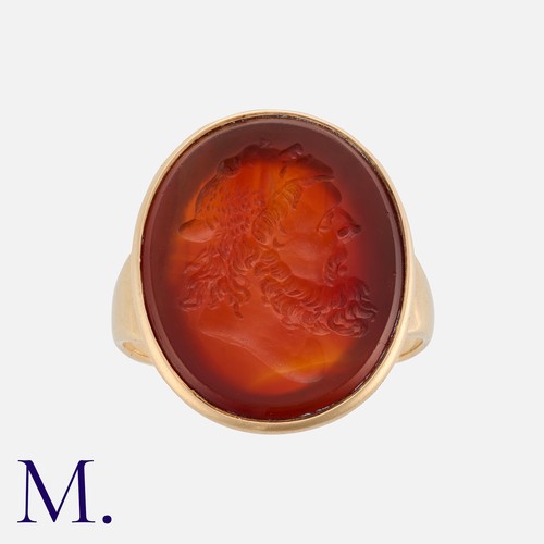169 - A Carved Carnelian Intaglio Ring in yellow gold, set with a carved carnelian intaglio depicting the ... 