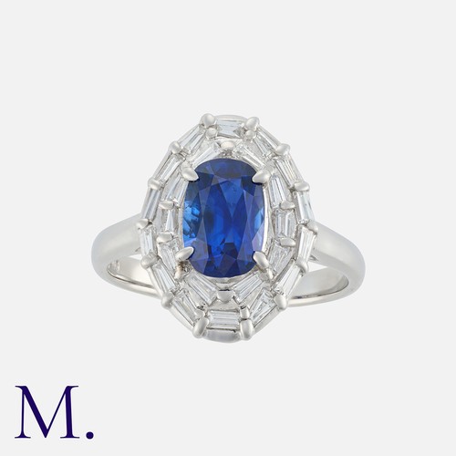 168 - A Sapphire and Diamond Ring in platinum, set with an oval cut sapphire of approximately 1.73 carats,... 