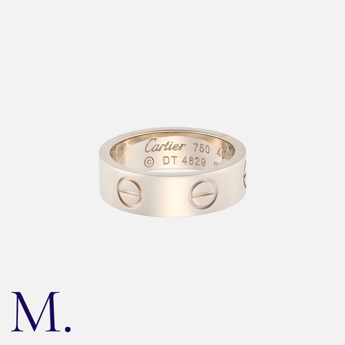166 - CARTIER. A Love Ring in 18K white gold.  The band 6mm wide.  Signed Cartier and serial numbered. 

S... 