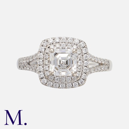 155 - A Diamond Ring in 18k white gold, set with a central Asscher cut diamond of 1.01cts set within a two... 