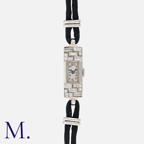 109 - An Art Deco Diamond Cocktail Watch in platinum and 18K white gold, set with round-cut and baguette-c... 