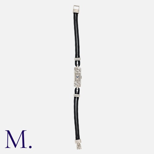109 - An Art Deco Diamond Cocktail Watch in platinum and 18K white gold, set with round-cut and baguette-c... 
