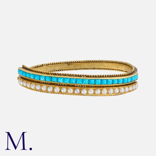 72 - An Antique Turquoise and Pearl Bangle in yellow gold, of twisted form, set with one row of sugarloaf... 