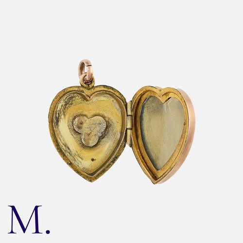 71 - A Ruby, Sapphire and Emerald Gold Cased Locket Pendant in yellow gold, of heart shape, set to the fr... 