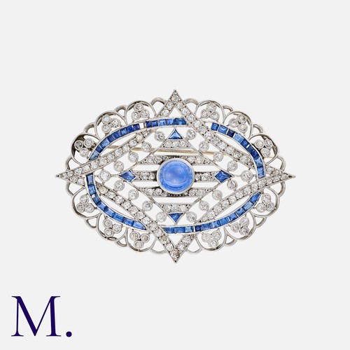 103 - An Edwardian Sapphire and Diamond Brooch, set to the centre with a cabochon sapphire with diamond an... 