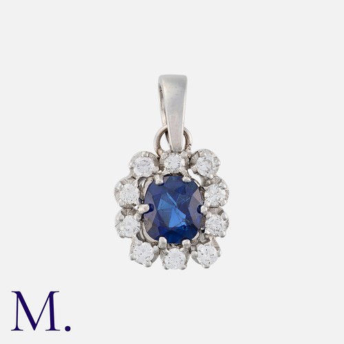 104 - An Unheated Ceylon Sapphire and Diamond Pendant in 18 carat white gold, set with a principal cushion... 