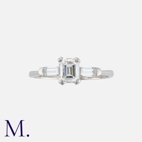 110 - A 1.02 Carat E Colour Diamond Ring in platinum, set with a principal emerald cut diamond of 1.02 car... 
