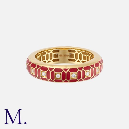 82 - An Enamel And Diamond Ring in 18 carat yellow gold, of geometric design, decorated with red enamel a... 