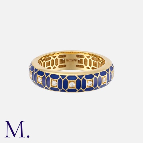 84 - An Enamel and Diamond Ring in 18 carat yellow gold, of geometric design, decorated with blue enamel ... 