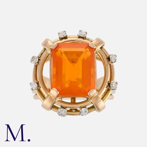 73 - A Fire Opal and Diamond Ring in 18 carat gold, set with an octagonal step cut fire opal of approxima... 