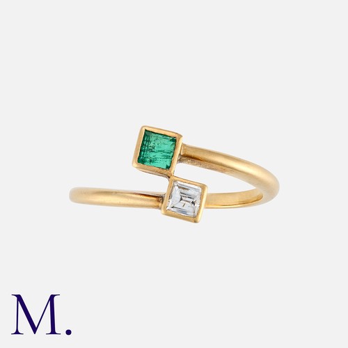 6 - An Emerald and Diamond Toi et Moi Ring in yellow gold, one terminal set with a square cut emerald, t... 