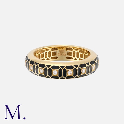 38 - An Enamel And Diamond Ring in 18 carat yellow gold, of geometric design, decorated with black enamel... 