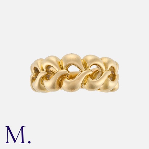 68 - VAN CLEEF & ARPELS. A Gold Heart Band in 18K yellow gold, with graduating stylised openwork hearts f... 