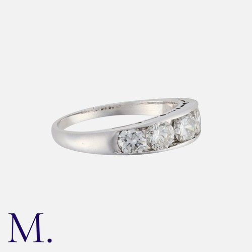 95 - A Diamond Five Stone Ring in white gold, comprising five channel set round brilliant cut diamonds to... 