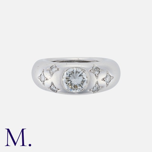 97 - CHAUMET. A Diamond Gypsy Ring in 18K white gold, set with a round brilliant diamond to the centre we... 