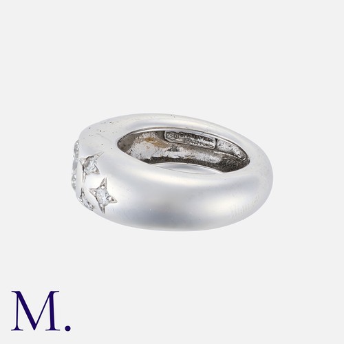 97 - CHAUMET. A Diamond Gypsy Ring in 18K white gold, set with a round brilliant diamond to the centre we... 