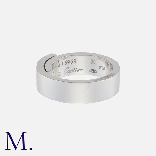 61 - CARTIER. A Diamond Band in 18K white gold with a brilliant cut diamond set to the centre of a folded... 
