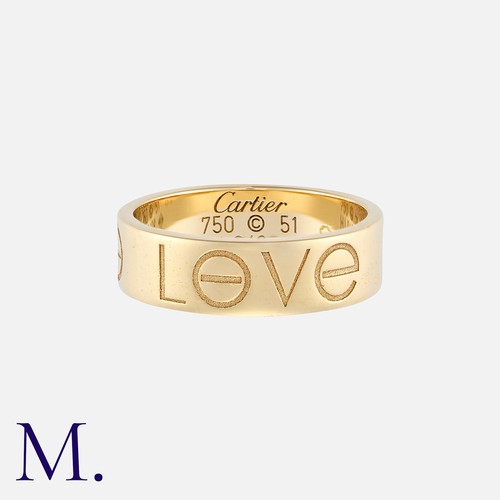 63 - CARTIER. A Love Ring in 18K yellow gold with 'LøVE' engraved to the outside of the band.  Signed Car... 