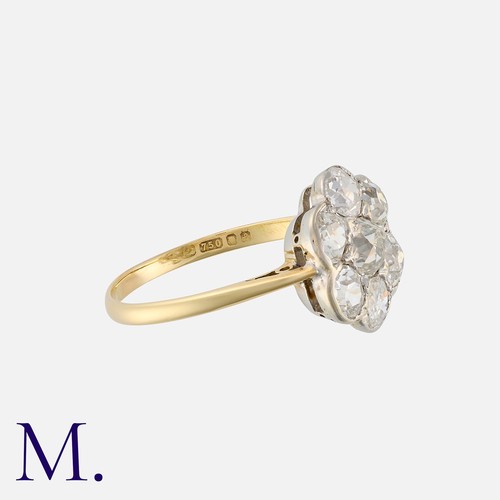 2 - An Old Cut Diamond Cluster Ring in 18 carat gold, set with a cluster of old cut diamonds totalling a... 