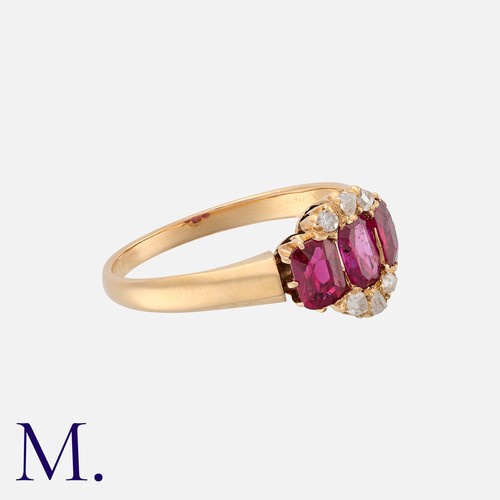 37 - An Edwardian Ruby and Diamond Ring in yellow gold, set with three oval cut rubies, accented by rose ... 
