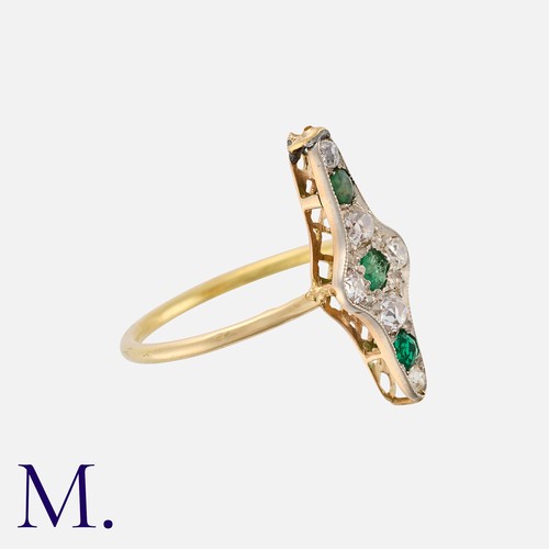 9 - An Emerald and Diamond Ring in yellow gold, the navette form set with old cut diamonds totalling app... 