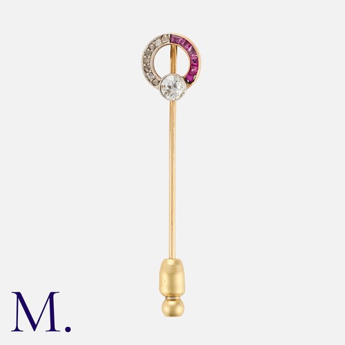 39 - A Ruby and Diamond Stick Pin in yellow gold, the terminal designed as an open circle, set with an ol... 
