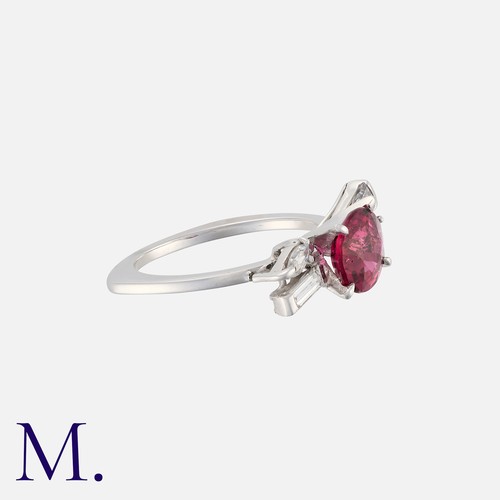 40 - A Rubellite Tourmaline and Diamond Ring in white gold. Set with a principal cushion cut rubellite to... 