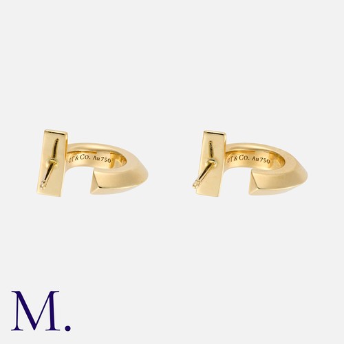 18 - Tiffany & Co. A Pair of 'T:T1' Hoop Earrings in 18 carat yellow gold, each comprising the capital le... 