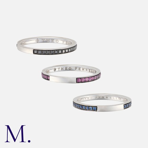 54 - THEO FENNELL, A Set of Stacking Rings in 18 carat white gold, one set with round cut black diamonds,... 
