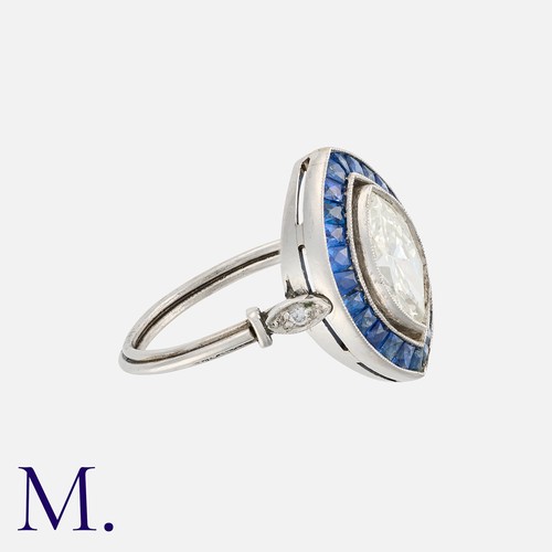50 - A Diamond and Sapphire Ring in platinum, set with a marquise cut diamond weighing approx. 1.6ct, wit... 