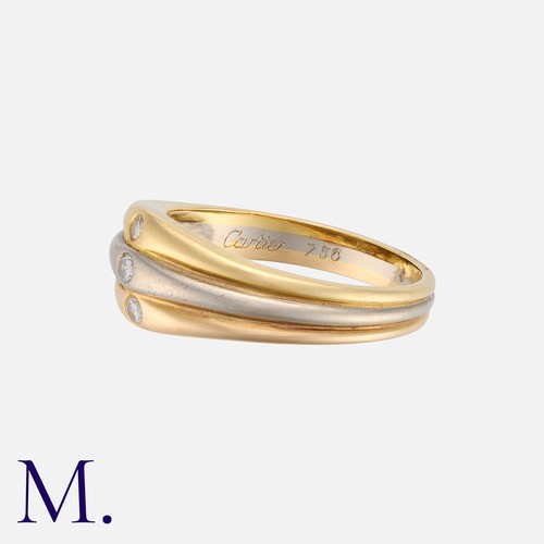 42 - CARTIER. A Diamond Ring in yellow, rose and white gold, with three tapering adjoining bands each set... 