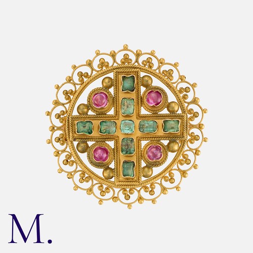 146 - An Antique Ruby and Emerald Brooch in yellow gold, set with four cabochon rubies and nine faceted em... 
