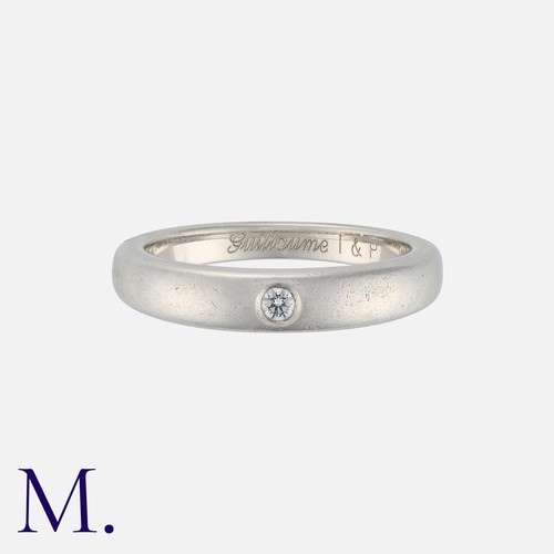 132 - VAN CLEEF & ARPELS. A Diamond Band in platinum, set with a round brilliant cut diamond accent to a p... 